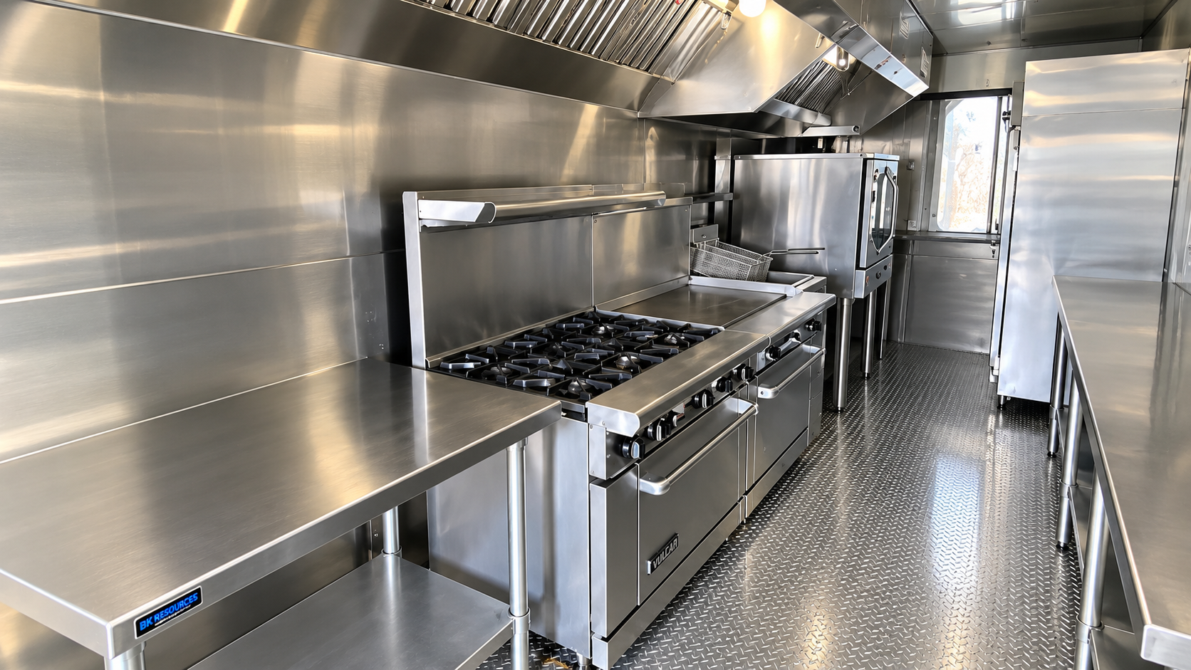 Commercial cooking line inside a 28 ft mobile kitchen trailer